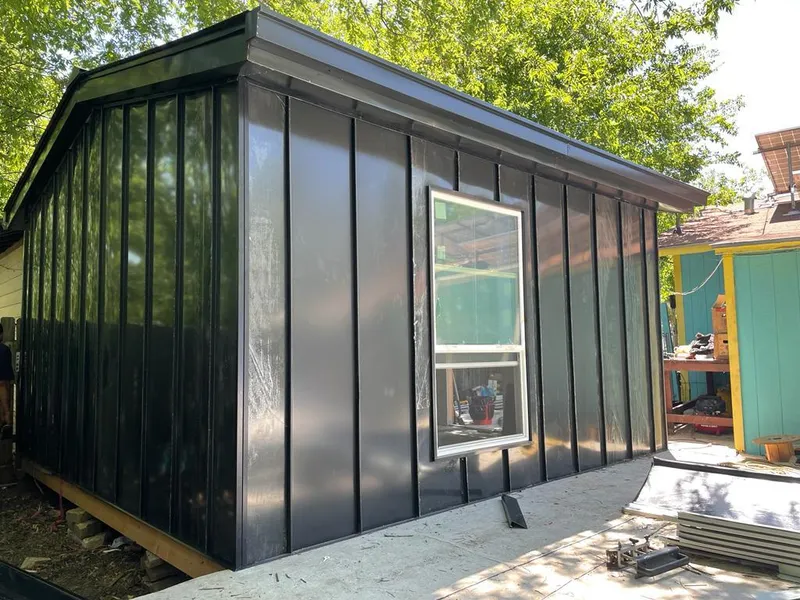 Black standing seam metal wall panels for Metal Roof Installation in Parkland